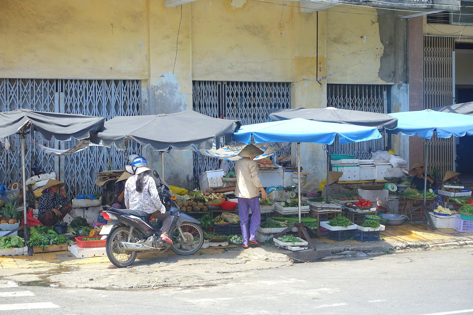 A street market in Vietnam with stalls of goods
