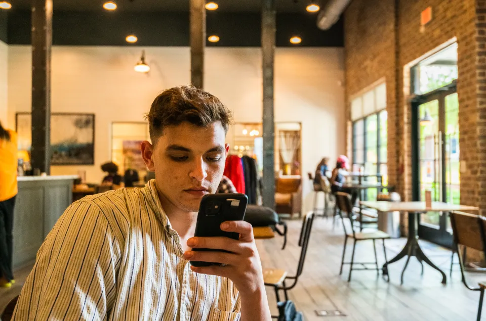 A person reading a listing on their phone